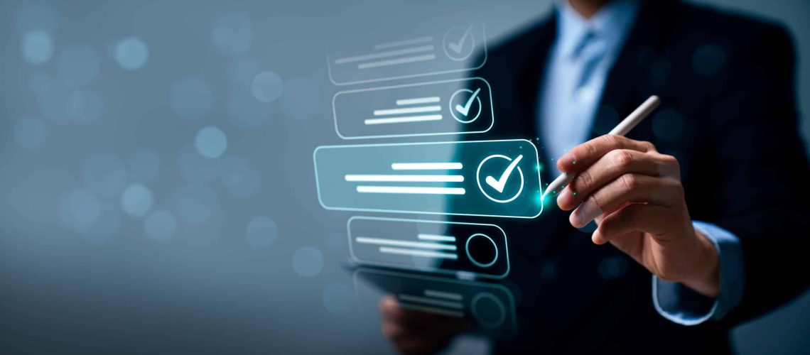 Business professional using digital checklist interface with checkmark icons, representing task completion, quality control, workflow management, and process verification